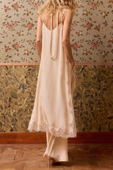 Back view of the nude Balma silk slip dress on fine straps