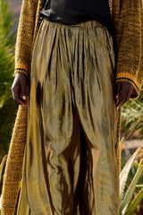 Close view of the charcoal and gold lurex cloth on the Leone trousers