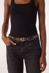 ba&sh Brooke Belt in black and gold, worn by model