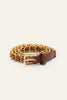 Brown leather belt threaded through gold chain with a square gold buckle, coiled