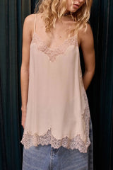 Nude Barry silk camisole worn over light blue jeans, lace at the neckline and hem