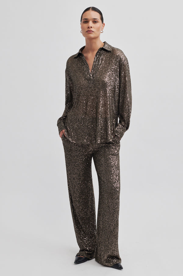 Second Female Moonshine Blouse in major brown sequin, worn by model with matching trousers, front view