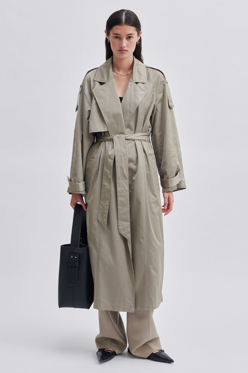 Second Female Walentin Trench Coat in roasted cashew, belted, worn by model, full length front