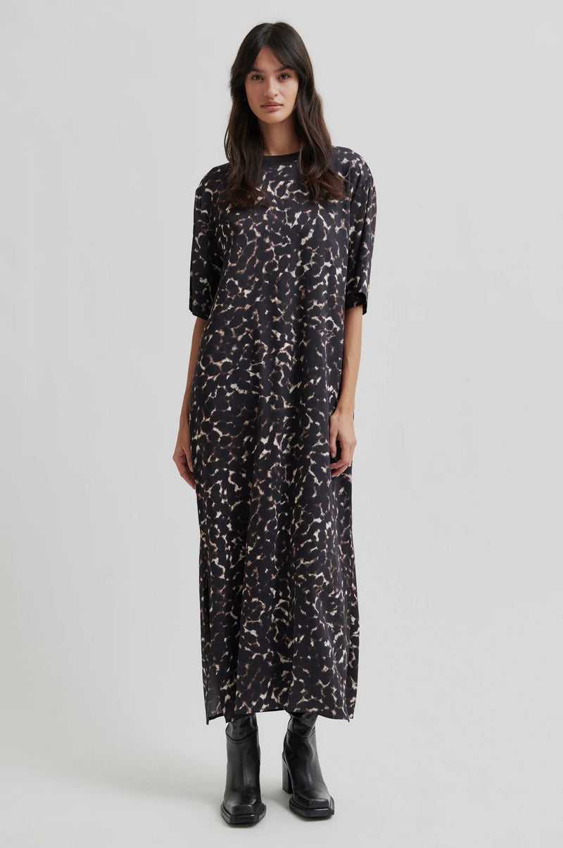 Second Female Savani Printed Dress in dark animal print, worn by model, full length front
