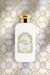 Santa Maria Novella Acqua della Regina Fluid Body Cream on patterned tiles, styled still life