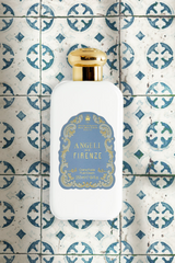 Santa Maria Novella Angeli di Firenze Fluid Body Cream on blue patterned tiles, styled still life