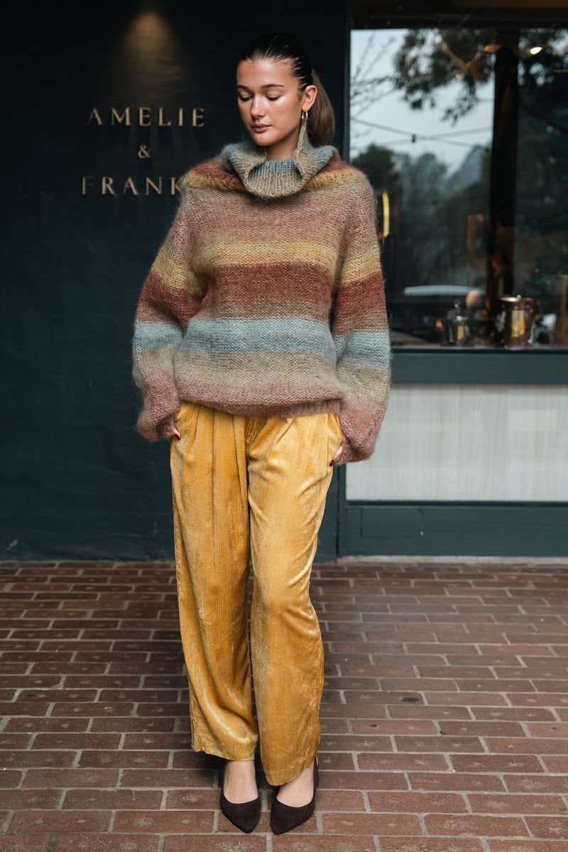 Mes Demoiselles Singa Trousers in yellow corduroy, worn by model outside the Amelie & Frank's boutique