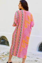 Devotion Twins Roubini Midi Dress in pink and orange, worn by model outdoors, back view