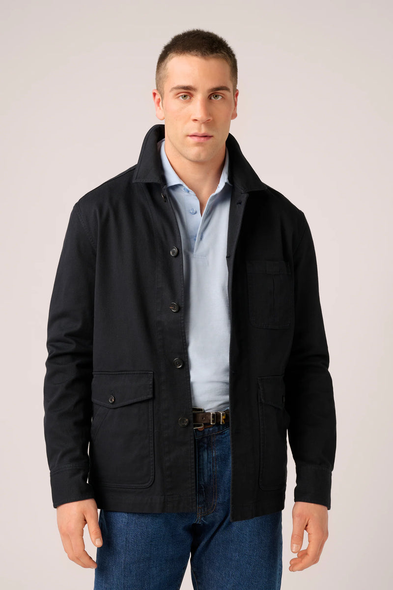 Christian Kimber Fitzroy Chore Jacket in midnight, worn open by model over a pale blue shirt, front view