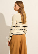 Auguste, Tommy Cardigan