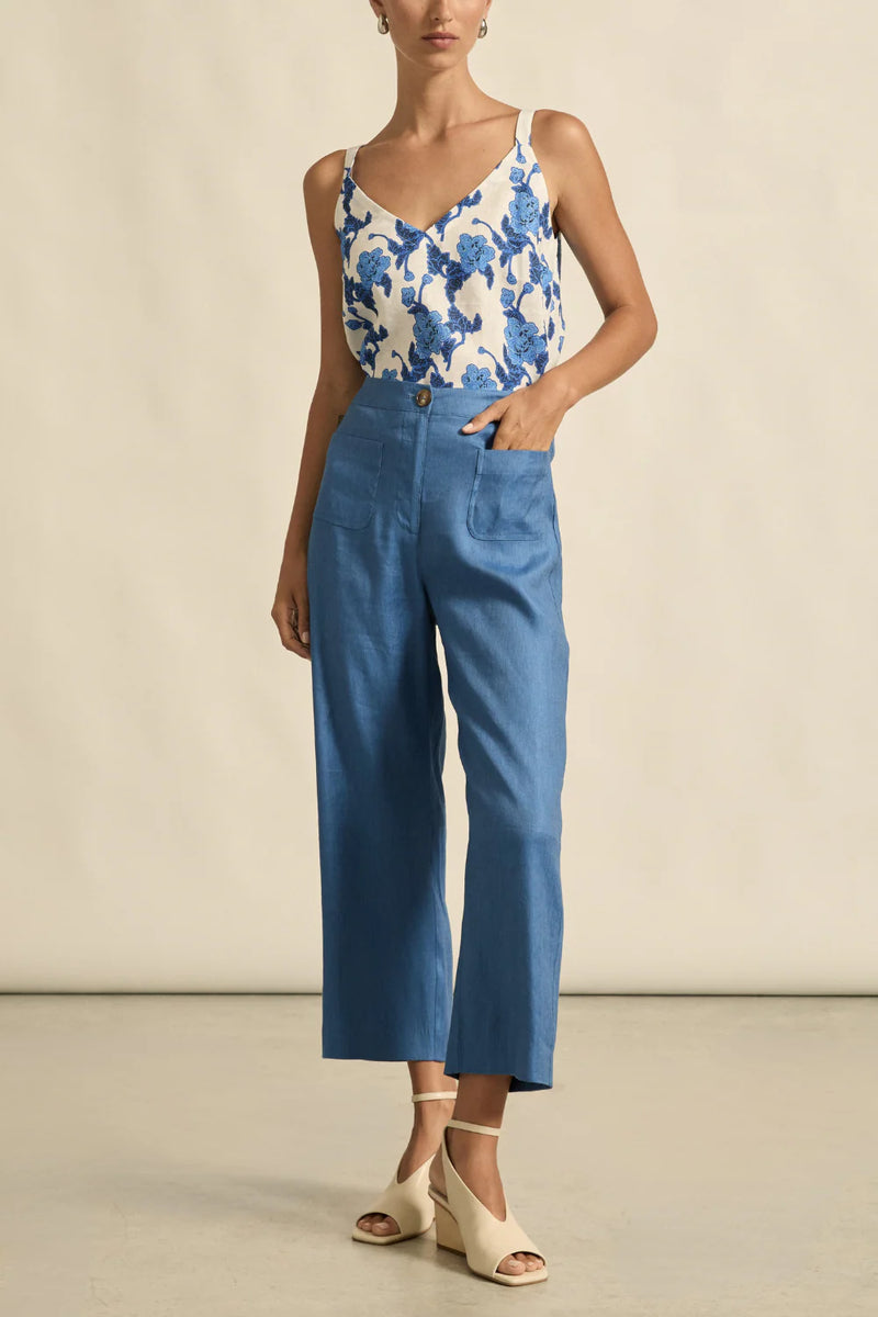 Zoe Kratzmann Memo Top in azure bouquet print, worn by model with blue trousers, full length