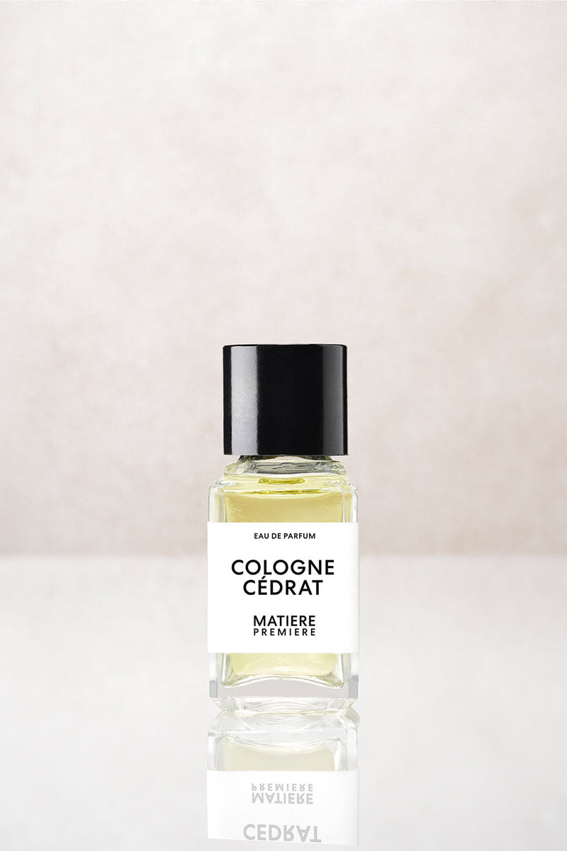 Matière Première Cologne Cédrat 6ml eau de parfum, small glass bottle with black cap on pale stone